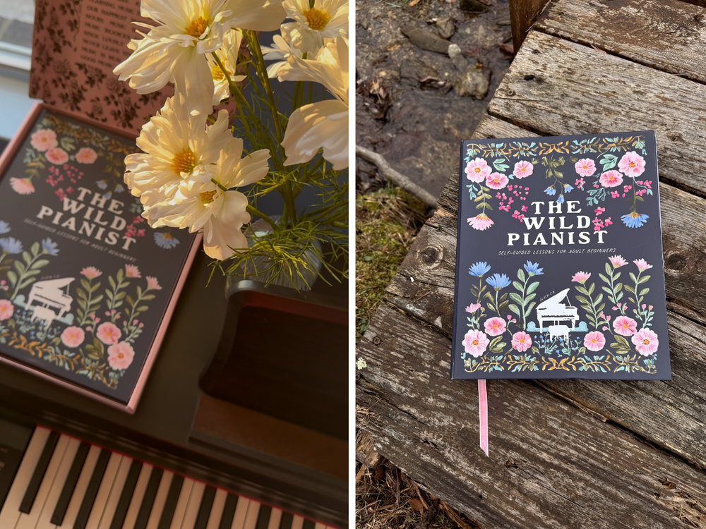 Book titled 'The Wild Pianist' with floral design on a wooden surface and next to flowers.