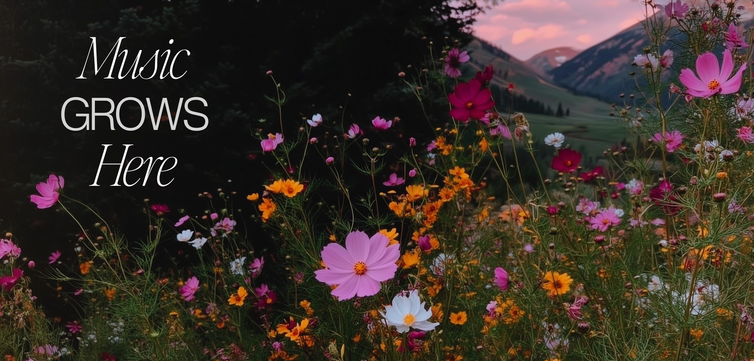 Wildflowers with mountains in the background and 'Music Grows Here' text.